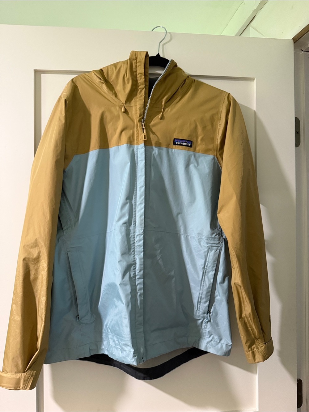 Patagonia women’s Two-Tone Hooded Windbreaker Jacket in Tan & Light Blue